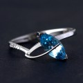 Ring White Gold with Stone Topazio Blue 9/5mm and 3 Diamonds of 0.5 Points