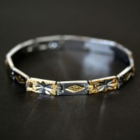 Pulseira de Aço com Detalhes em Ouro Amarelo Pulseira de Aço com Detalhes em Ouro Amarelo