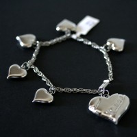 Steel Bracelet Twisted Heart a great job and 5 Small Hearts